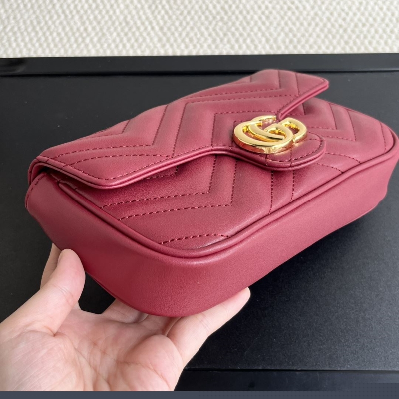 G*u*i clutch bags